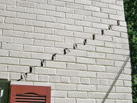 Stair-step cracks showing in a home foundation in Orillia