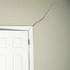 A long drywall crack beginning at the corner of a doorway in a Port Hope home.