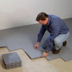 basement subfloor tiles being installed by a contractor in Woodbridge