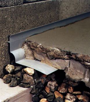 a custom designed basement drain system for thin basement floors in Maple.