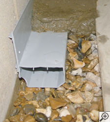 A no-clog basement french drain system installed in Barrie